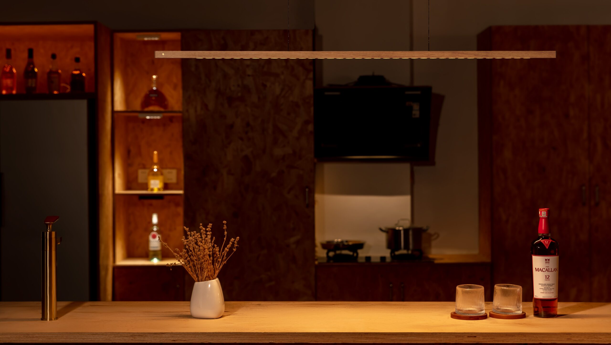 Lumatree solid wood pendant photographed above a wooden table