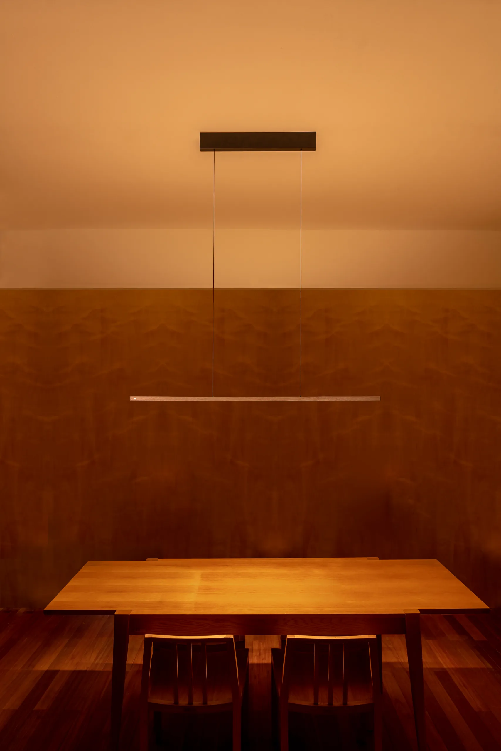 Lumatree Pendant photographed above a wooden dining table