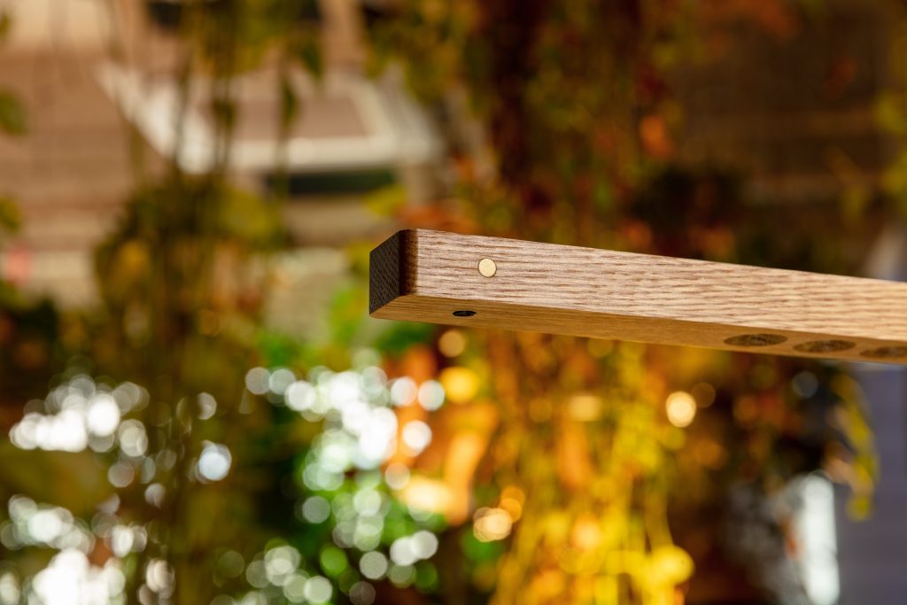 Lumatree Pendant solid wood grain, brass marker and recessed underside optics